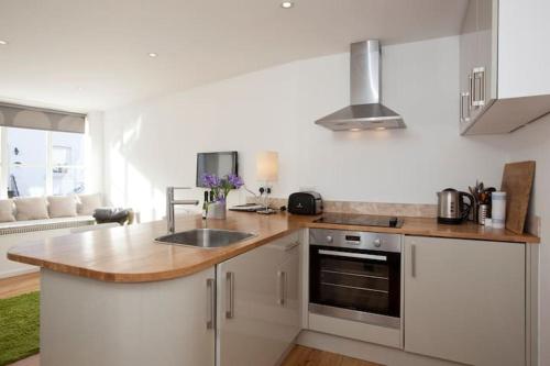 a kitchen with a sink and a counter top at The Old Post Office,Hassocks in Ditchling