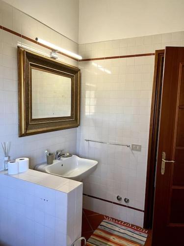 a bathroom with a sink and a mirror at Apartment in Villa La Carruba in Rivergaro