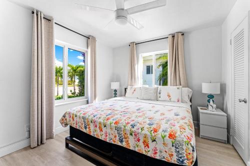 a bedroom with a bed and a window at Wonderful 3br Steps To The Beach Wheated Pool in Fort Lauderdale