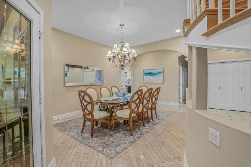 a dining room with a table and chairs at Indoor Pool near Grand Haven with Lake Michigan Beach! in Norton Shores