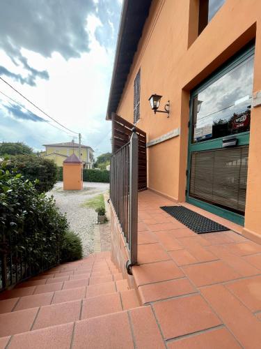 a door to a house with a brick patio at Locanda Settecamini in Campello sul Clitunno
