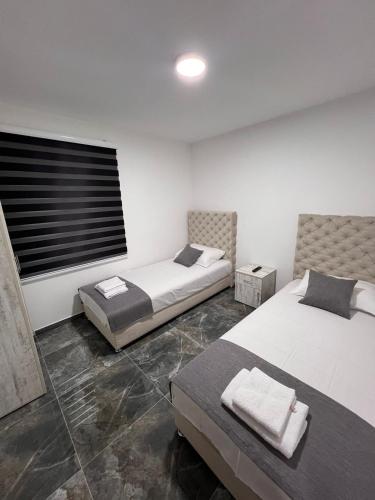 A bed or beds in a room at Apartmani River Priboj