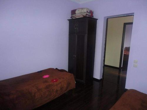 a bedroom with a bed and a dresser in a room at Надежда in K'obulet'i
