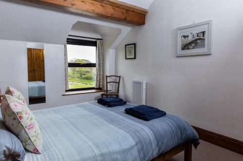 Postel nebo postele na pokoji v ubytování Old Nog Cottage