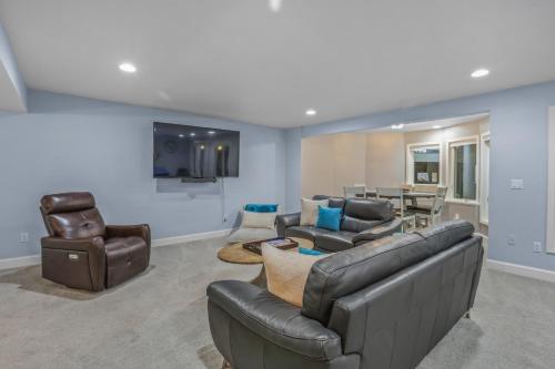 a living room with a couch and chairs and a table at Indoor Pool near Grand Haven with Lake Michigan Beach! in Norton Shores