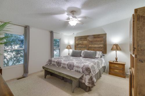 a bedroom with a bed and a ceiling fan at Spacious Home 10 Miles to Wintergreen Resort! in Nellysford