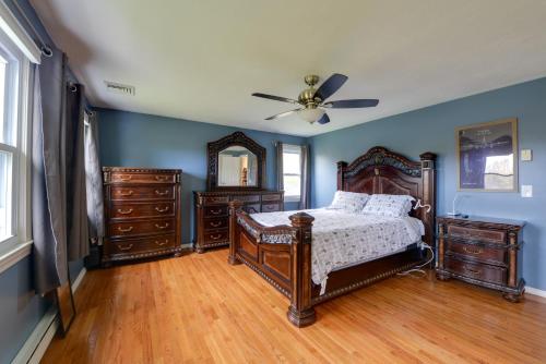 a bedroom with a bed and a ceiling fan at Spacious Oxford Home with Pool - 4 Mi to Lake! 