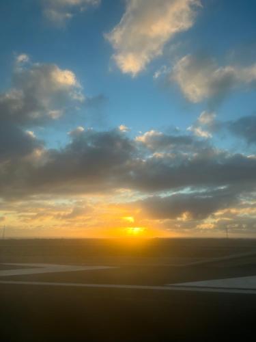 a sunset seen from an airplane at Min 26 in Caleta De Fuste