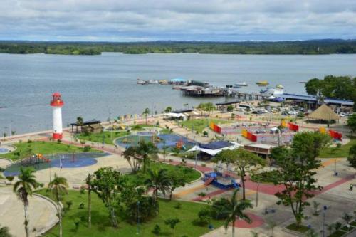 an amusement park with a lighthouse in the water at Apartamento Buenaventura in Buenaventura