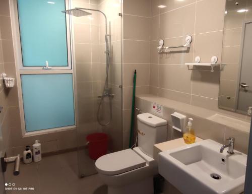 a bathroom with a toilet and a sink and a shower at Leisure homestay@Sutera Avenue 2-0519 in Kota Kinabalu