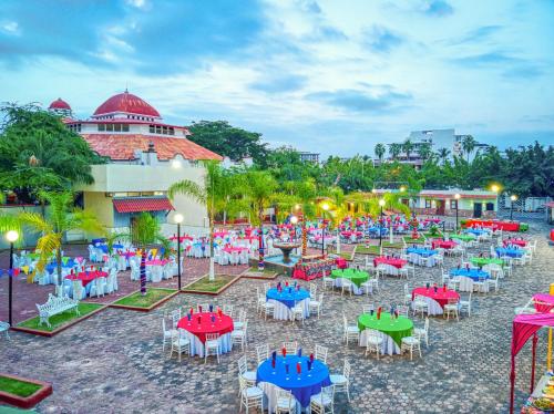 a group of tables and chairs in front of a building at Krystal Vallarta in Puerto Vallarta
