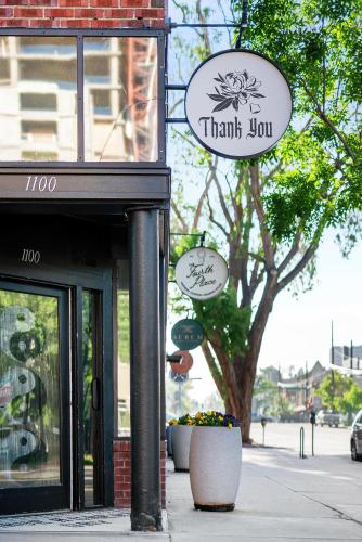 a store with a sign that reads thank istg istg at The Acoma House in Denver