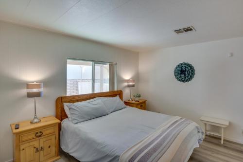 a bedroom with a bed and a window at Riverfront Bullhead City House with Balcony! in Bullhead City