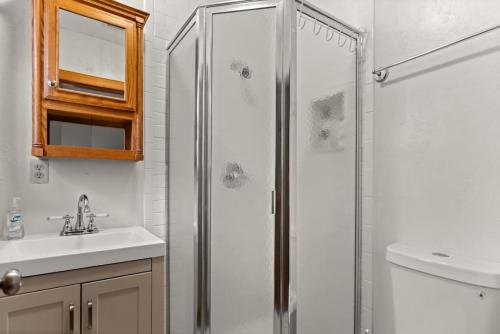 a bathroom with a shower and a sink at Amazing 2br 2ba with Loft C in Gainesville