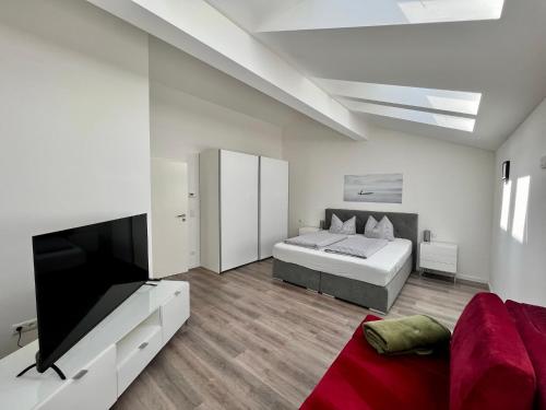 a bedroom with a bed and a flat screen tv at "Riverside" in Prem