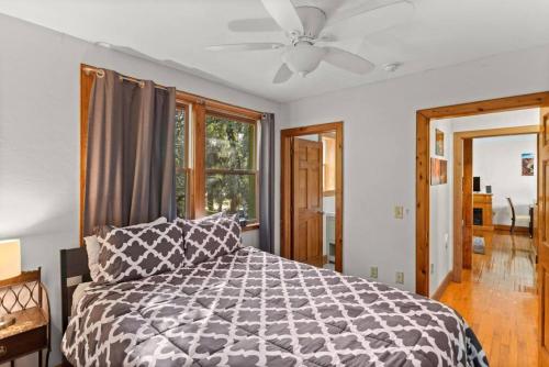 a bedroom with a bed and a ceiling fan at Amazing 2br 2ba with Loft C in Gainesville
