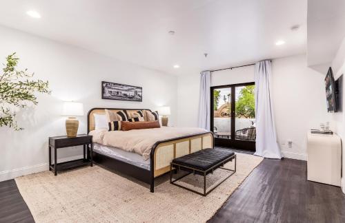 a bedroom with a king sized bed and a window at Live Above Shops and Restaurants in Oldtown Scottsdale in Scottsdale