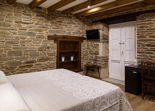 Ένα ή περισσότερα κρεβάτια σε δωμάτιο στο Casa Baran