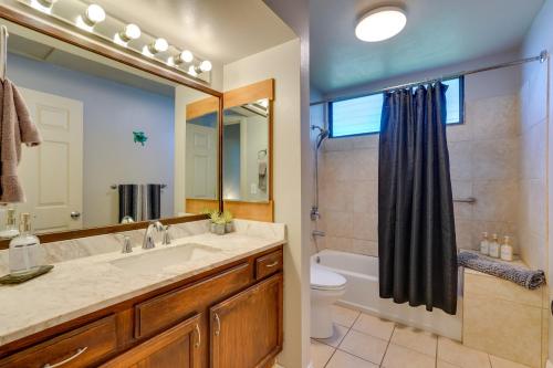 a bathroom with a sink and a shower and a toilet at Top-Floor Kailua Bay Resort Condo with Ocean Views! in Kailua-Kona