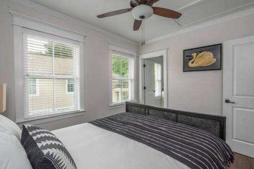 a bedroom with a bed and a ceiling fan at Rose carriage House Savannah in Savannah