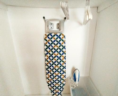 a tie hanging on a wall in a room at 生活超便利的小公寓 in Athens
