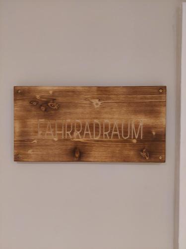 a sign on a wall with the word unemployment at Bocksberg-Lodge in Goslar
