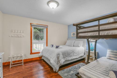 a bedroom with two bunk beds and a window at Indoor Pool Near Grand Haven & Lake Michigan Beach in Spring Lake