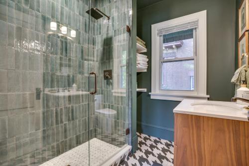 a bathroom with a shower and a sink at Saint Paul Vacation Rental Near Downtown! in Saint Paul