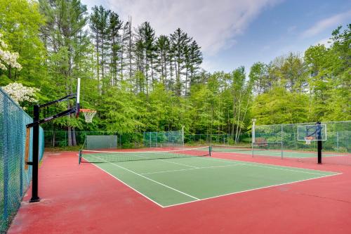 a tennis court with two tennis nets on it at Inviting Bartlett Condo 1 Mi to Attitash Mountain in Bartlett