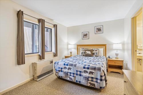 a bedroom with a bed and a window at Cedarbrook Queen Suite 108 in Killington