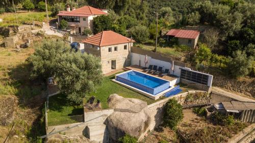 an aerial view of a house with a swimming pool at Casa Douro River in Frende