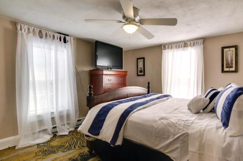 a bedroom with a bed and a ceiling fan at Charming Salisbury Getaway with Grill and Fire Pit! in Salisbury