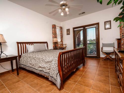 a bedroom with a bed and a ceiling fan at El Dorado Ranch San Felipe Rental Condo 57-2 in San Felipe