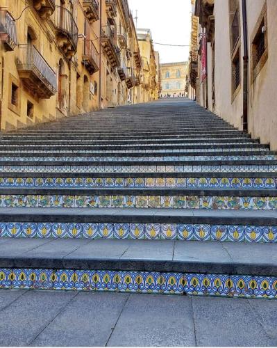 a set of stairs in the middle of a street at Guest House Al Viale in Caltagirone