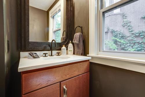 a bathroom with a sink and a window at Pet-Friendly Saint Paul Rental Near Downtown! in Saint Paul