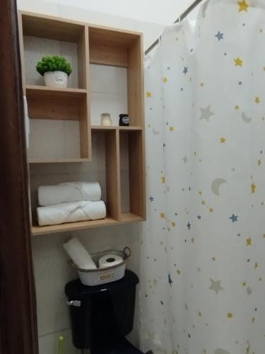a bathroom with a shower with stars on the wall at Departamento Aventura in Manta