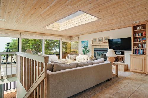 a living room with a couch and a television at 2166 Sherwood in Cambria