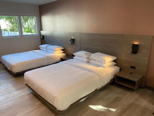 Postel nebo postele na pokoji v ubytování Rolo Beach Hotel