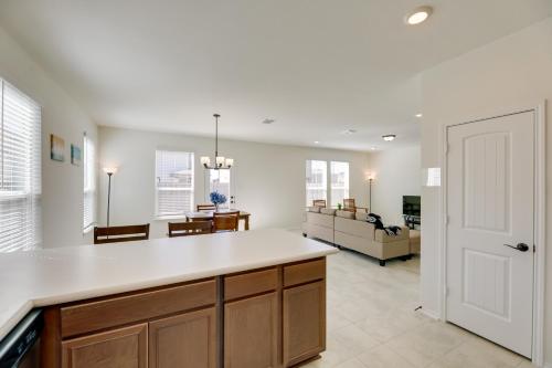 a kitchen and living room with a large white counter top at Manor Vacation Rental with Yard 17 Mi to Austin! in Manor