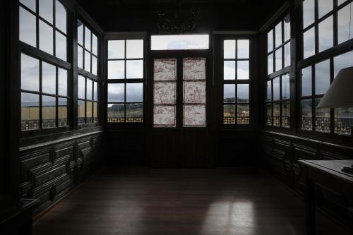 an empty room with windows in a building at CASA RURAL PALACIO CONDE DE ALDANA con piscina entre encinares y dehesas in Terradillos