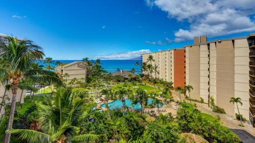 an aerial view of a resort with a pool and palm trees at Maui Westside Presents: Kaanapali Shores 733 Stunning Ocean Views NEW LISTING in Lahaina