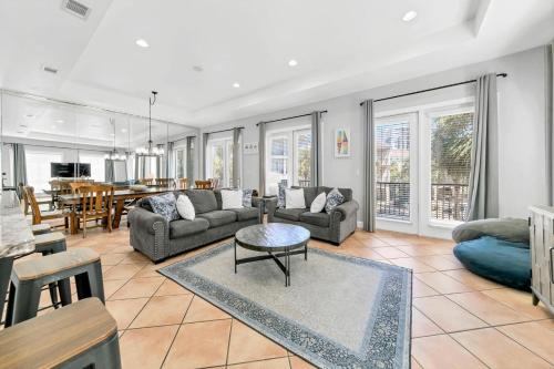 a living room with a couch and a table at Our Destiny in Dunes of Destin - Is a 4BR with Private Pool and close Beach Access in Destin