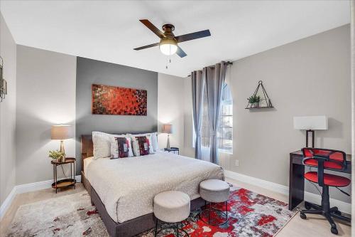 a bedroom with a bed and a ceiling fan at Gorgeous and Spacious home! in Las Vegas