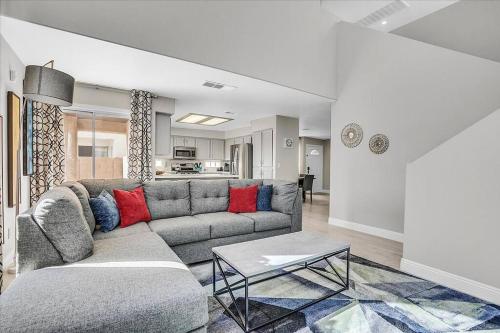 a living room with a couch and a table at Gorgeous and Spacious home! in Las Vegas