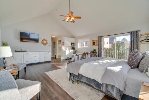 a bedroom with a bed and a large window at Charming Getaway, Walk to Windsor Lake and Downtown! in Windsor