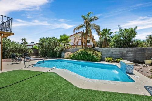 a swimming pool in the yard of a house at 4BR Family Home, Private Pool & BBQ, Near Strip in Las Vegas