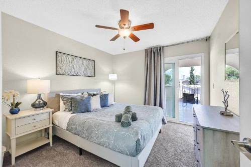a bedroom with a bed with a ceiling fan at 4BR Family Home, Private Pool & BBQ, Near Strip in Las Vegas