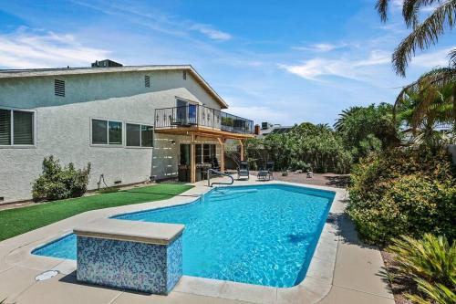 a swimming pool in front of a house at 4BR Family Home, Private Pool & BBQ, Near Strip in Las Vegas