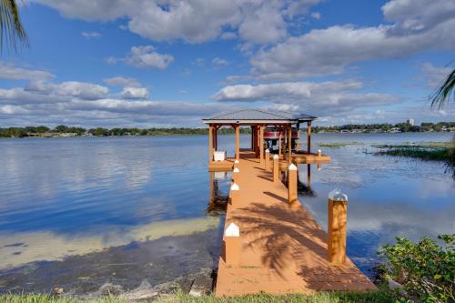 a dock on a body of water at Lakefront Winter Haven Retreat Hot Tub and Patio! in Winter Haven