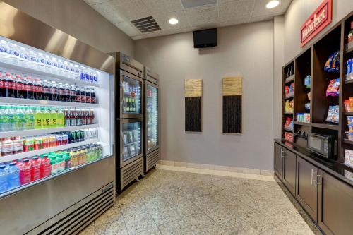 a grocery store aisle with soda and drinks at Drury Inn & Suites St Joseph in Saint Joseph
